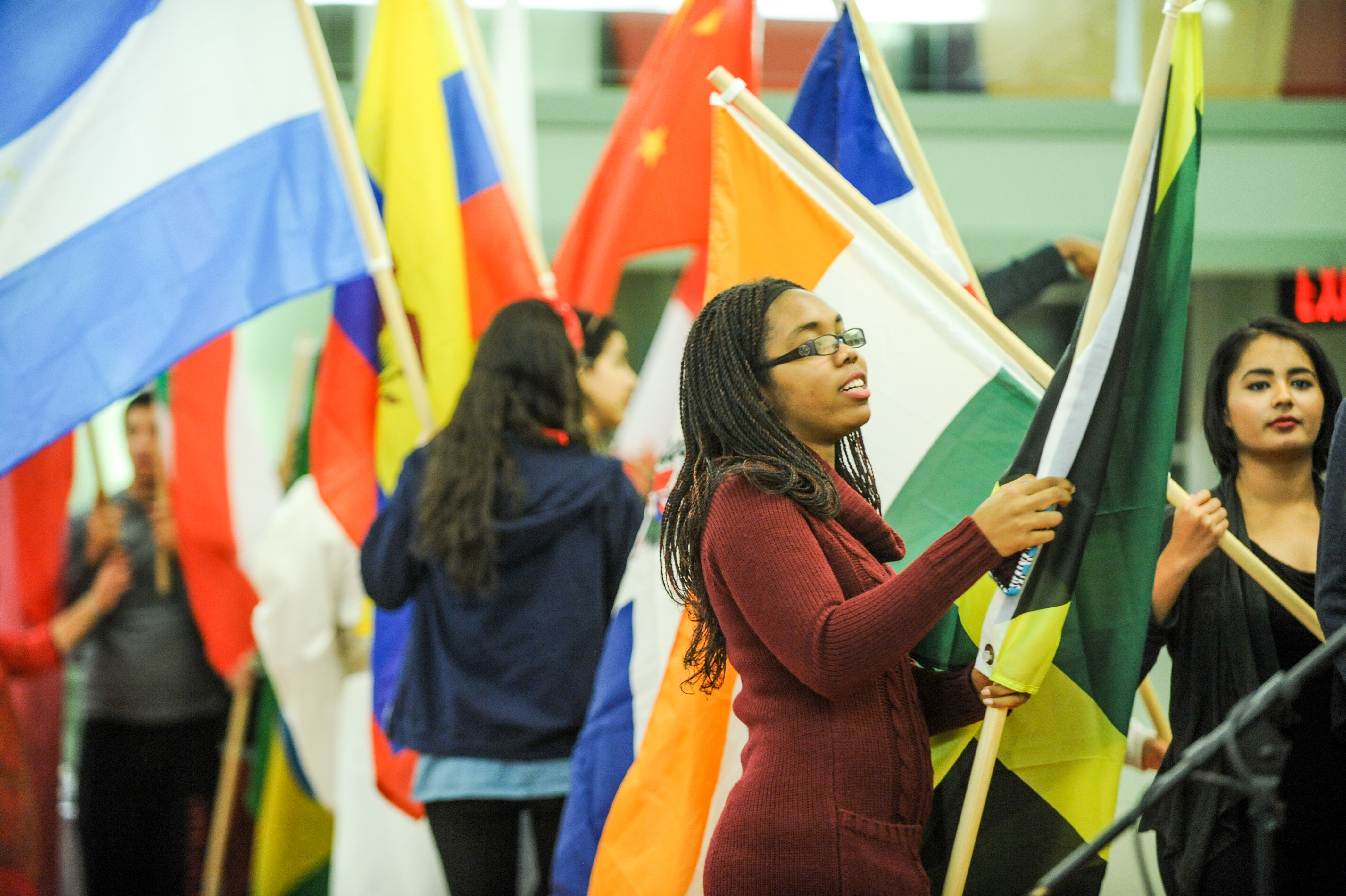 Picture of students carrying various national flags