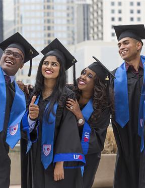 Picture of students taking a selfie on graduation day. 