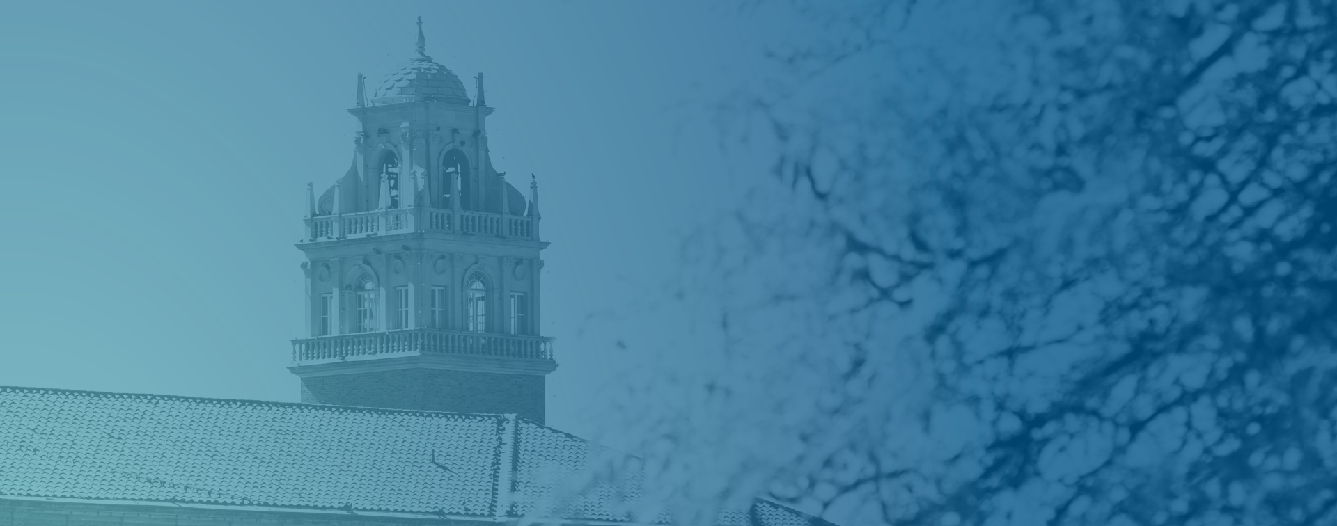Blue-tint photo illustration of an ornate university building tower 