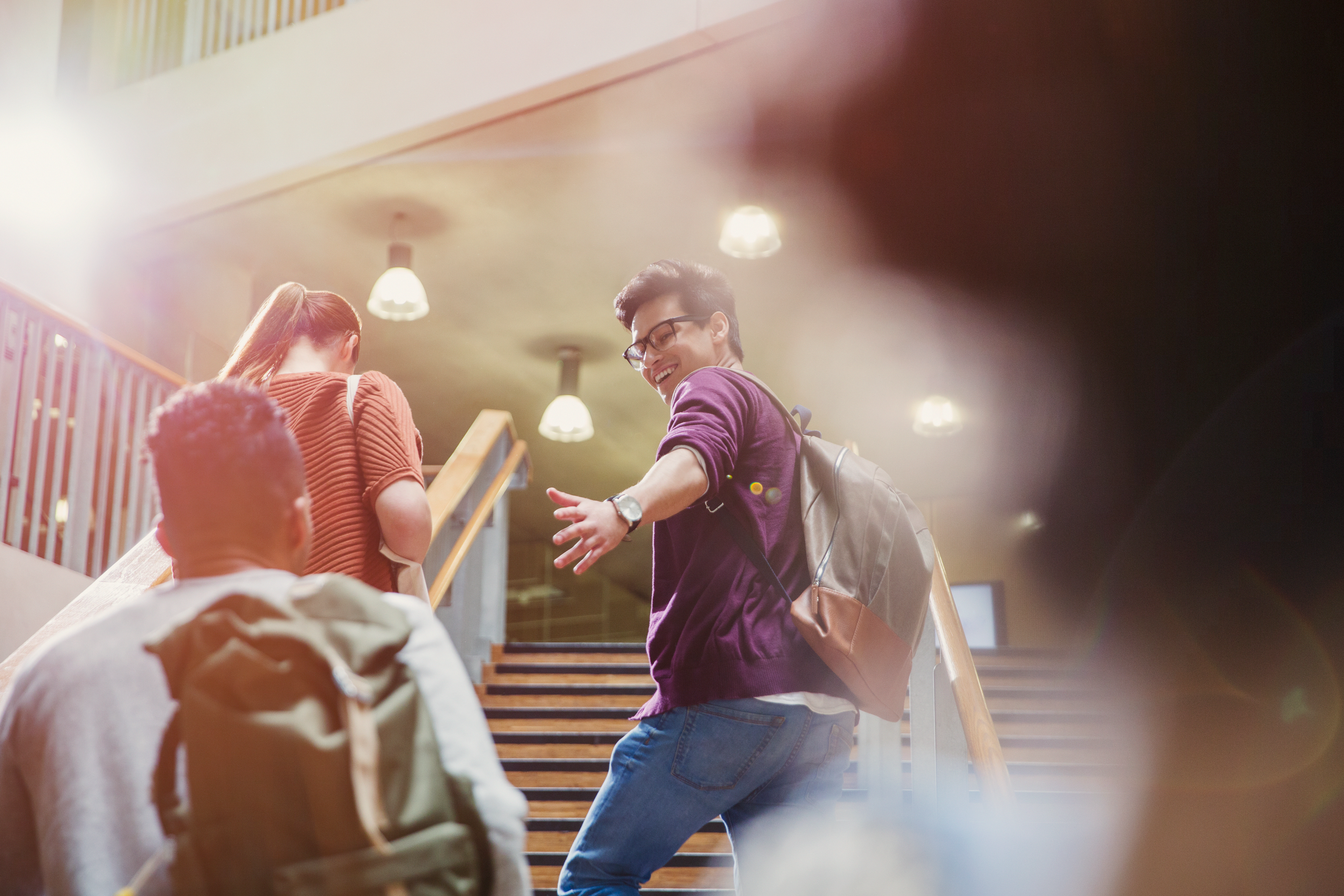 Photo of students climbing campus building stairwell