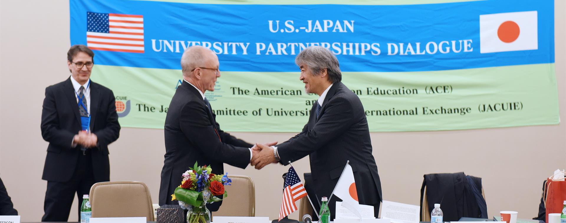 Picture of Ted Mitchell shaking hands with Juichi Yamagiwa.