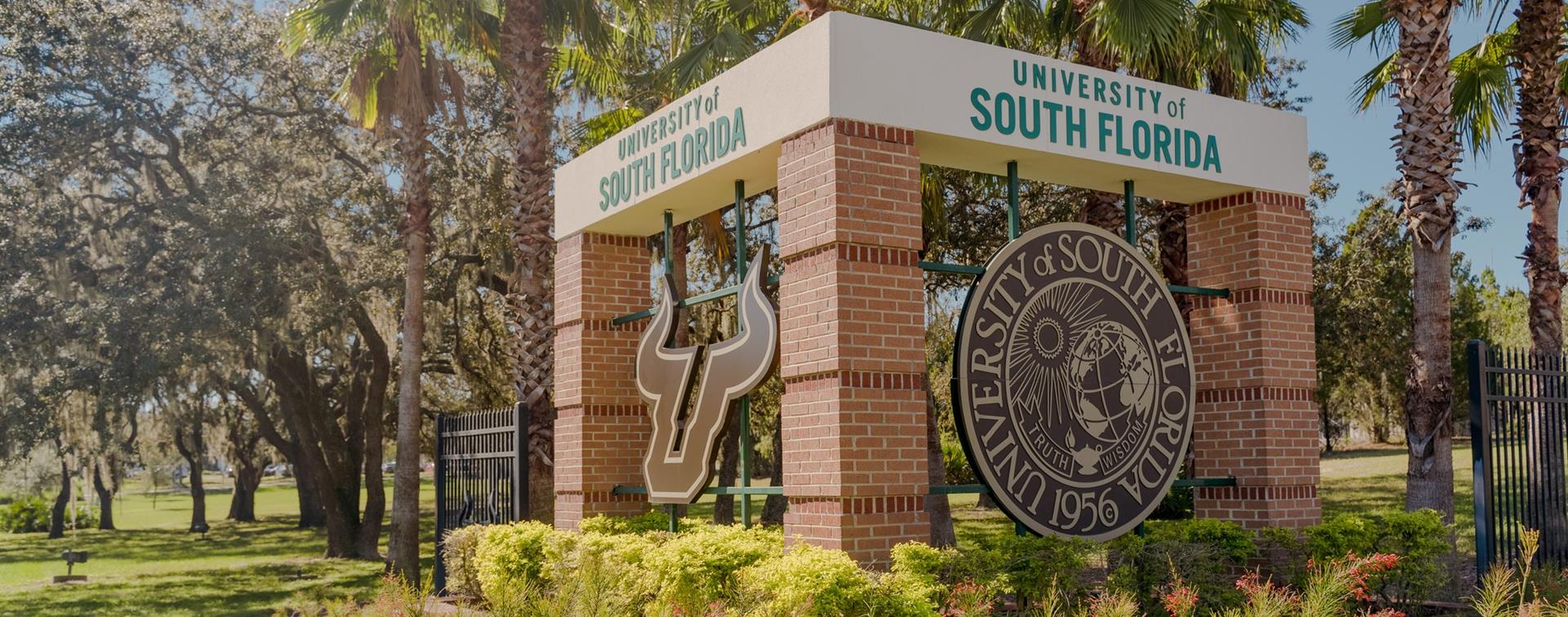 Image of University of South Florida gate showing the school's seal.