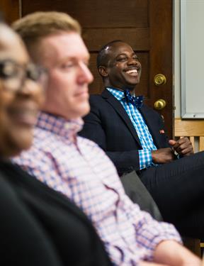 Picture of professionals laughing together. 
