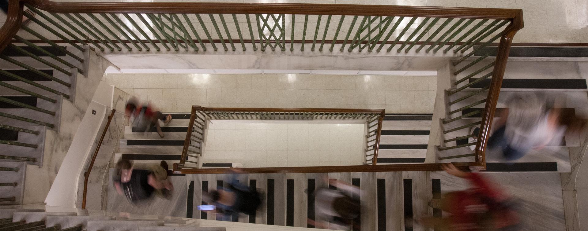 A picture of people walking down a staircase