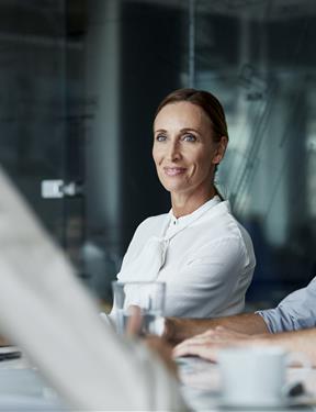 Picture of a woman smiling while at work. 
