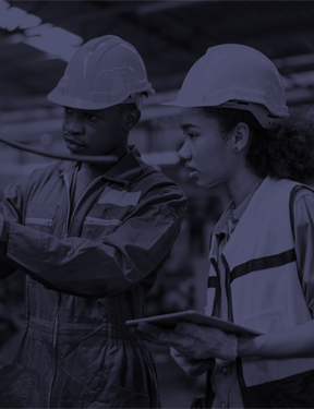 Man and woman in hard hats and safety vests