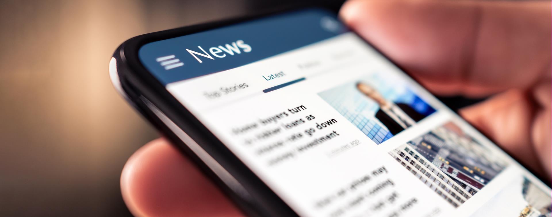 A picture of a man reading a newspaper