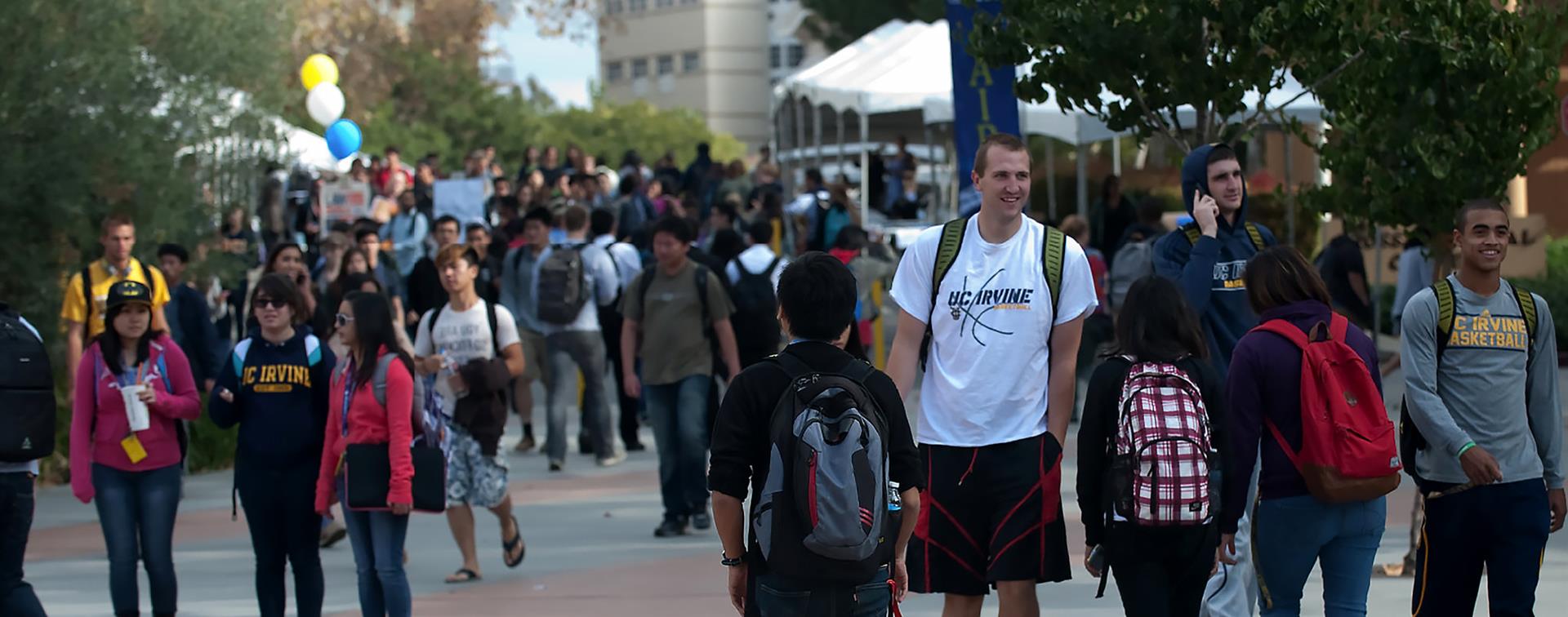 Picture of students milling on the Ring Mall at University of California, Irvine