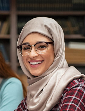 Smiling woman wearing a head scarf